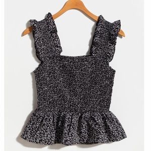 Smocked black and white peplum top